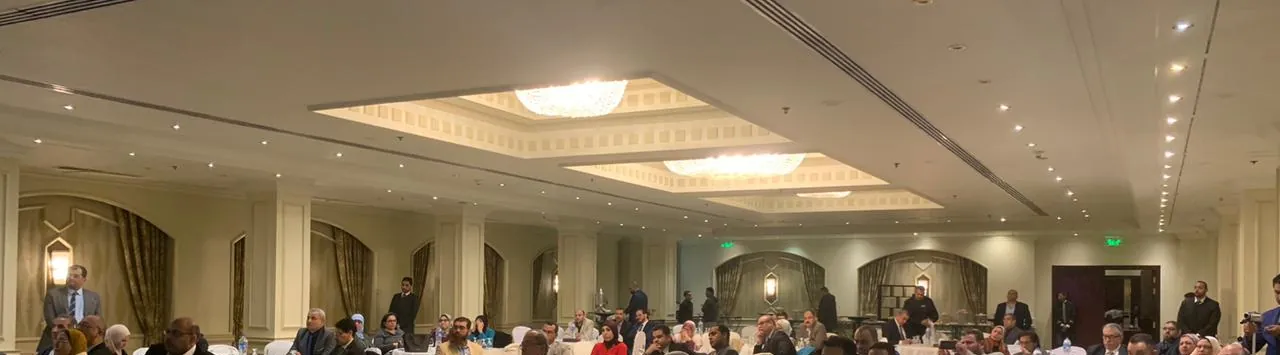 Participants seated at round tables in a hotel hall during the EQA Darts launch event