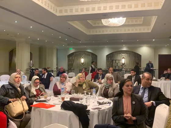Participants seated at a round table